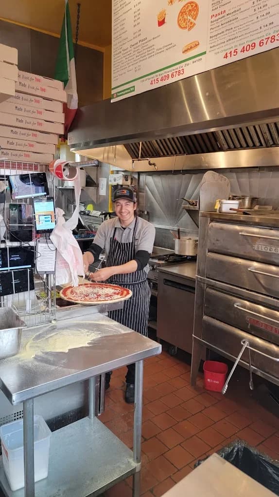 Fresh margherita pizza made behind the counter in San Francisco
