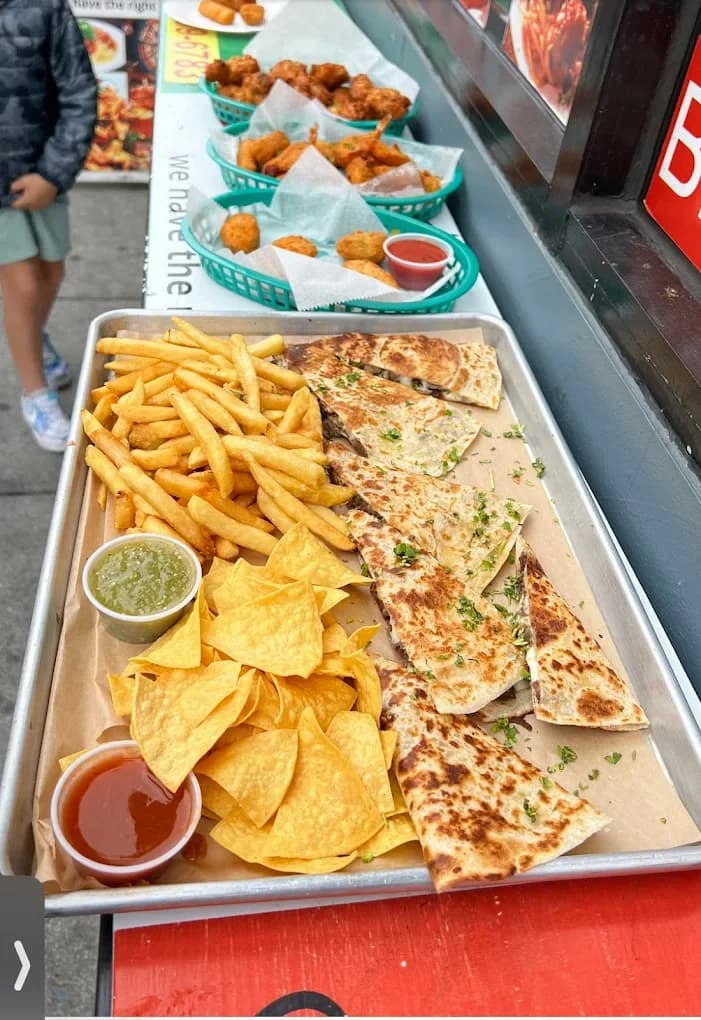 Loaded platter with fries, quesadilla and wings in San Francisco