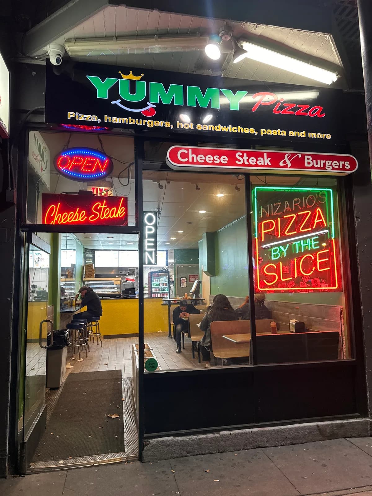 Yummy Pizza Valencia storefront with Cheese Steak neon, San Francisco
